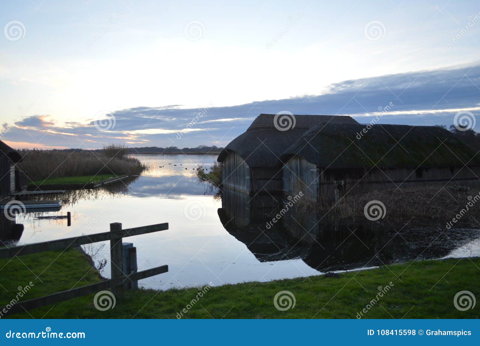 tranquillity at the hickling broad norfolk thatched boathouses