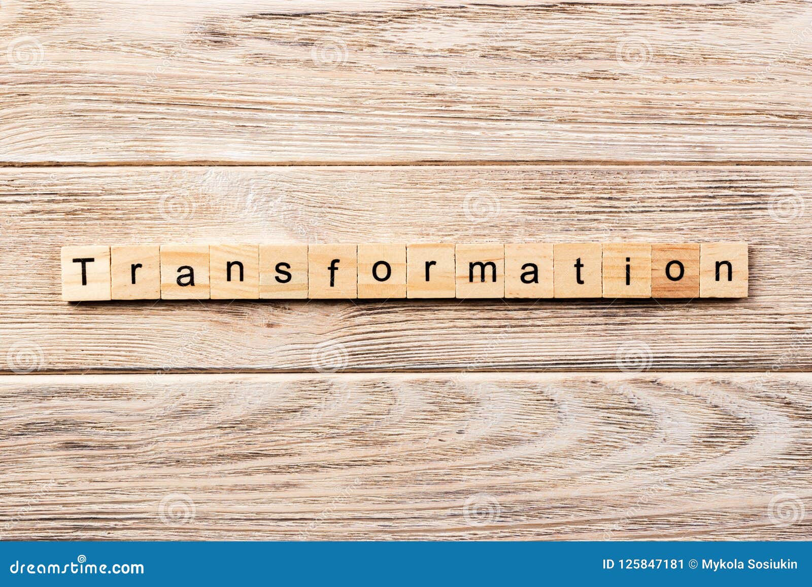 Transformation Word Written on Wood Block. Transformation Text on Table