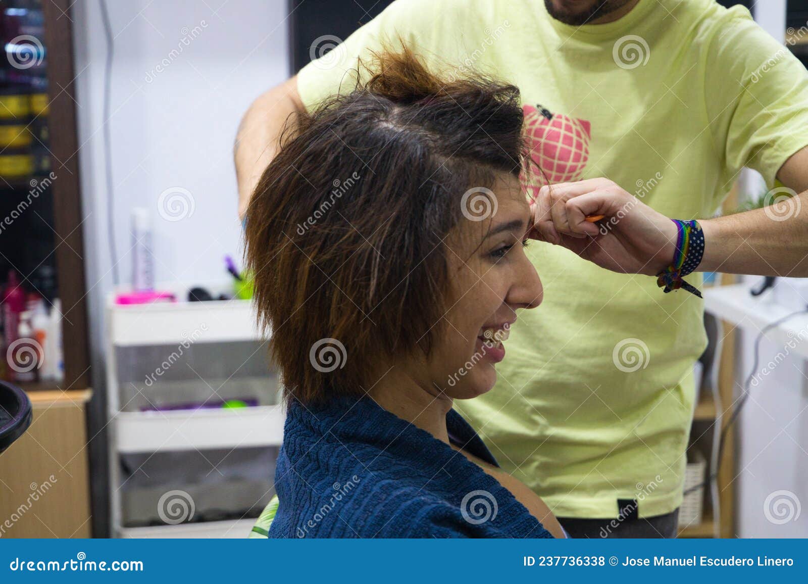 Transgender Woman Combing Her Hair with Hairdryer, Comb and Hair  Straightener in the Beauty Salon by the Professional Stylist. Stock Photo -  Image of product, balsam: 237736338