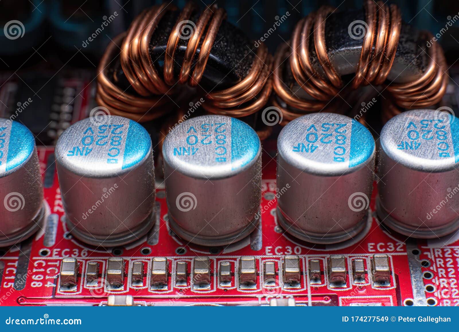 Transistors and Coils on a Red Motherboard Stock Image Image of