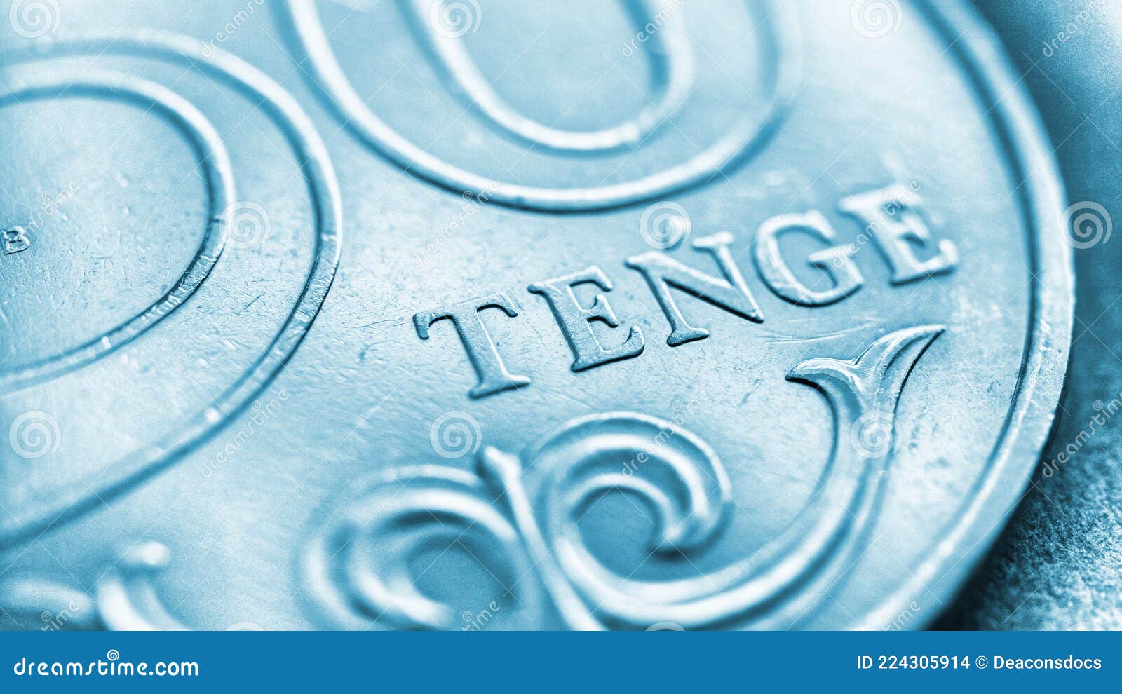 Translation: Tenge. Fragment of a Kazakh Coin in 50 Tenge. Light Blue Tinted Background or Wallpaper Photo - of micro, change: 224305914