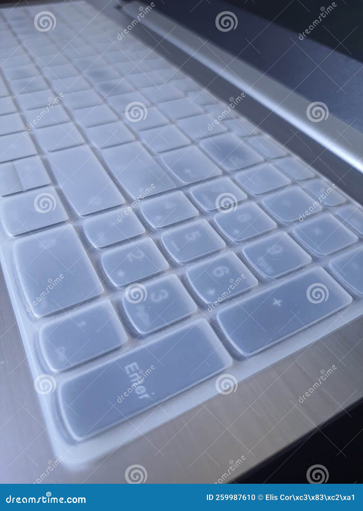 A Translucent Silicone Keyboard Cover on a Black Keyboard. Stock Photo