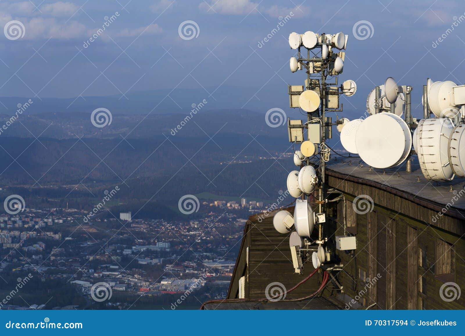 transmitters and aerials on the telecommunication tower during sunset