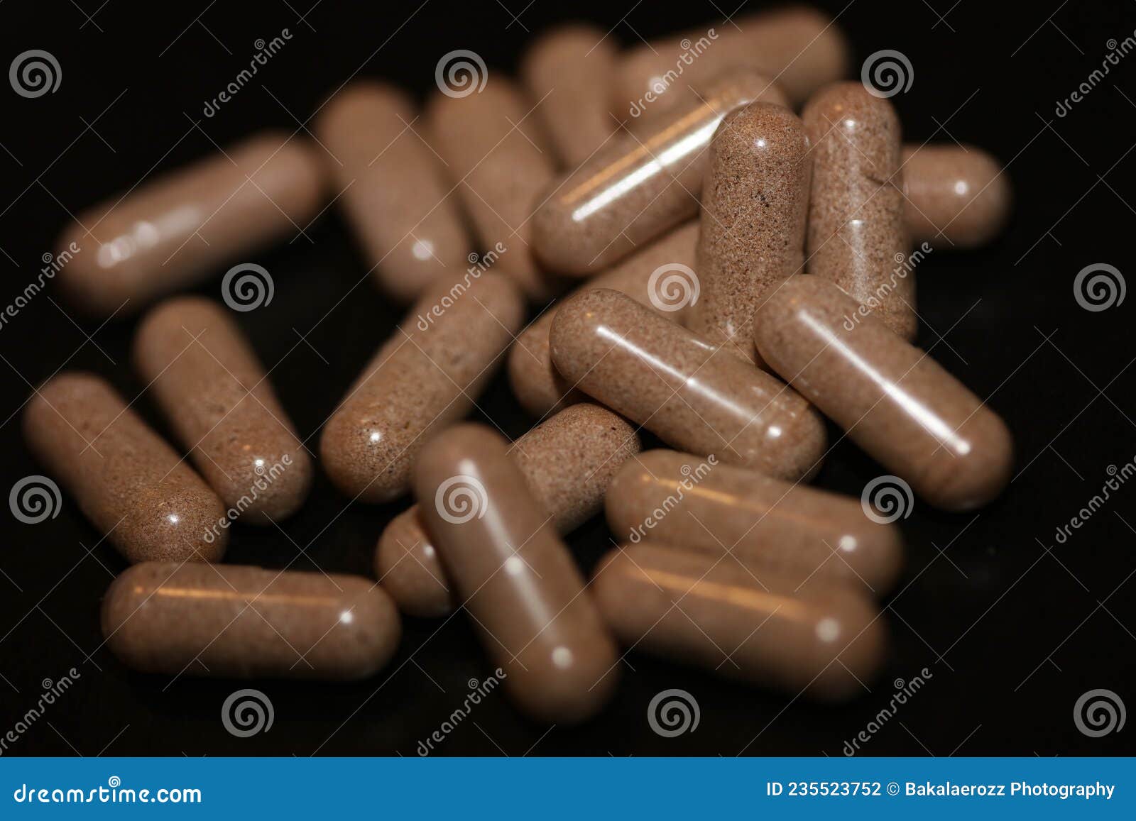 Transparent Capsules Filled With Brown Vitamins Powder Close Up transparent-capsules-filled-with-brown-vitamins-powder-close-up
