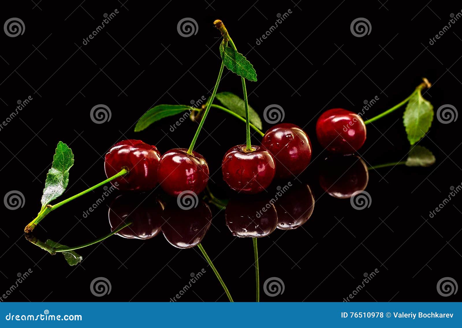 Transparent Cup With Red Ripe Cherries On Black Background Stock Photo