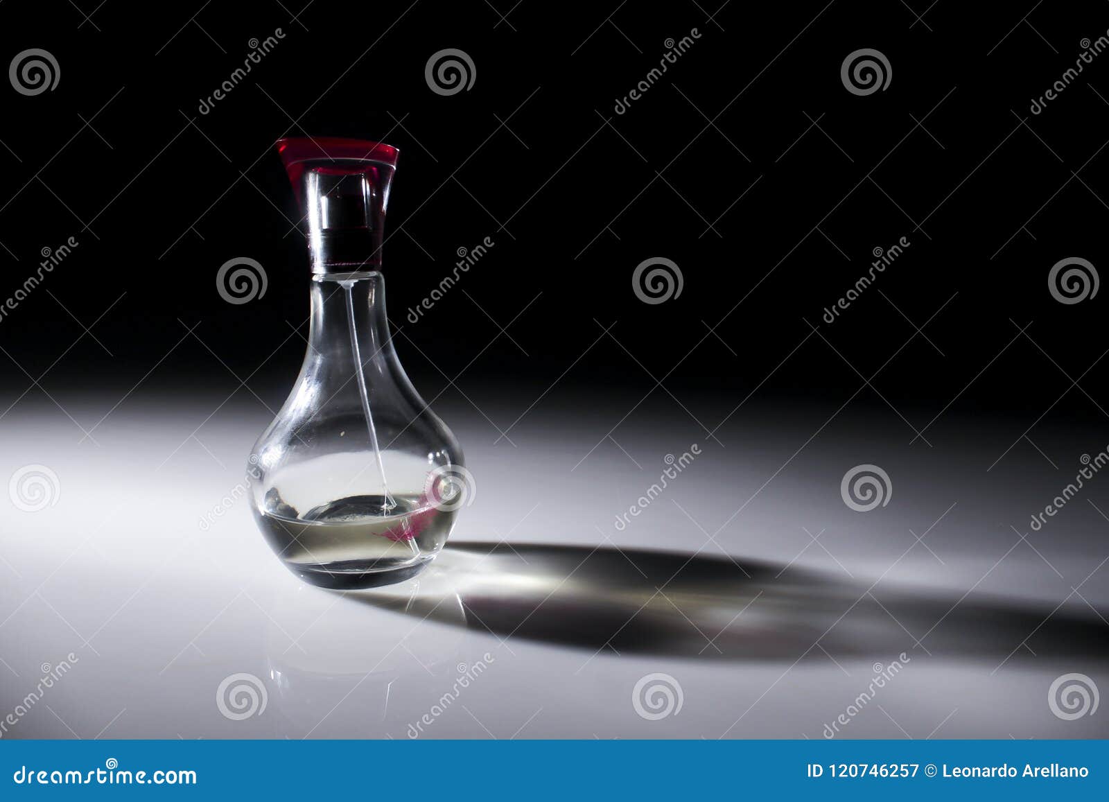 transparent perfume bottle with pink lid