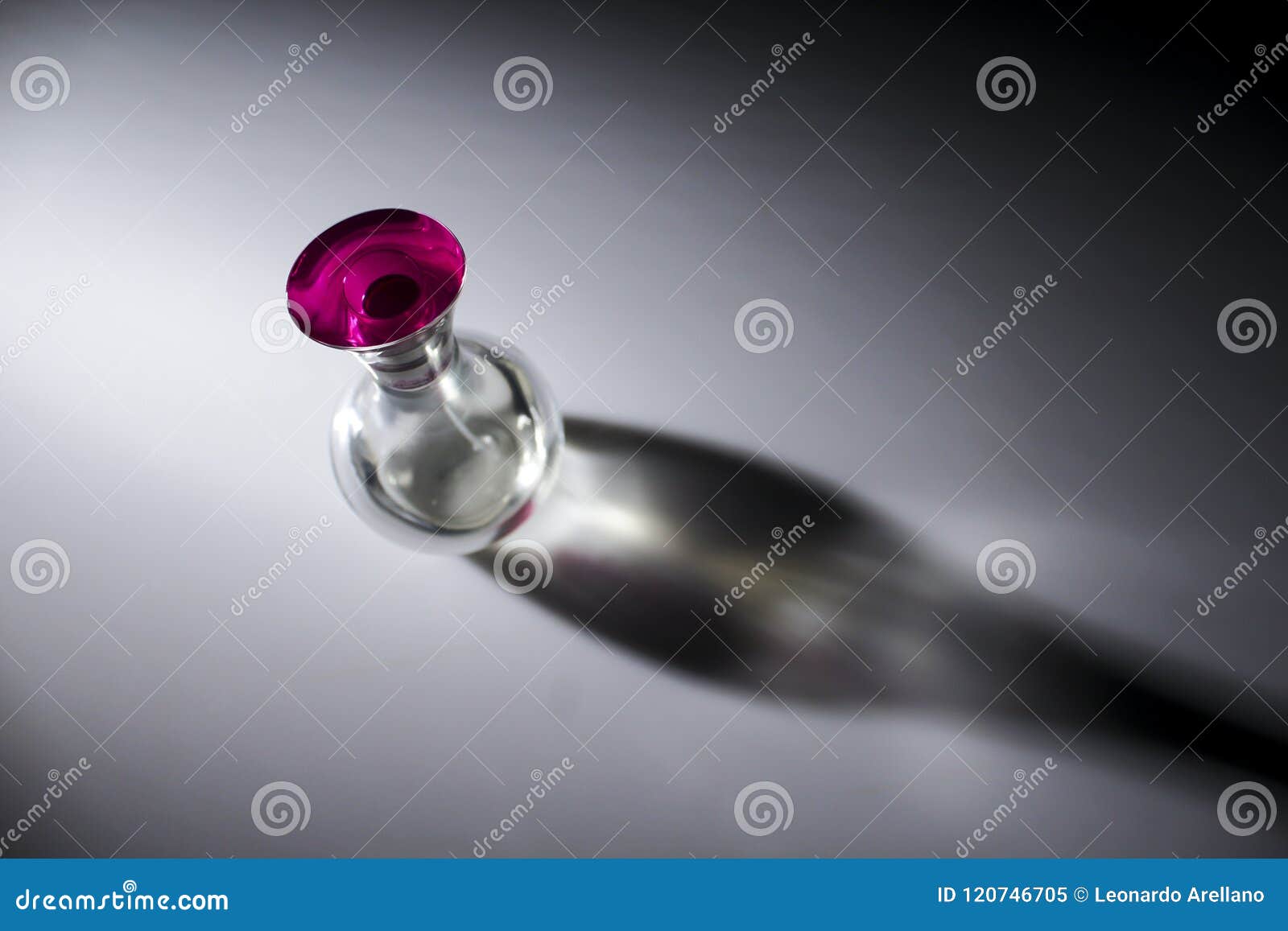 transparent perfume bottle with pink lid