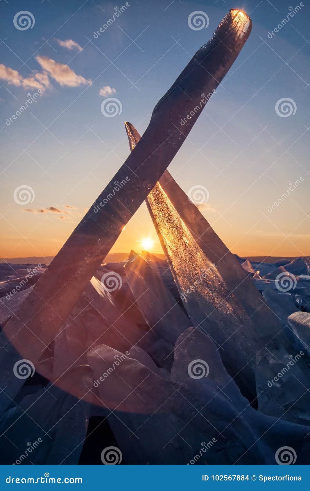 transparent piece of ice on surface of frozen lake. low depth-in view.