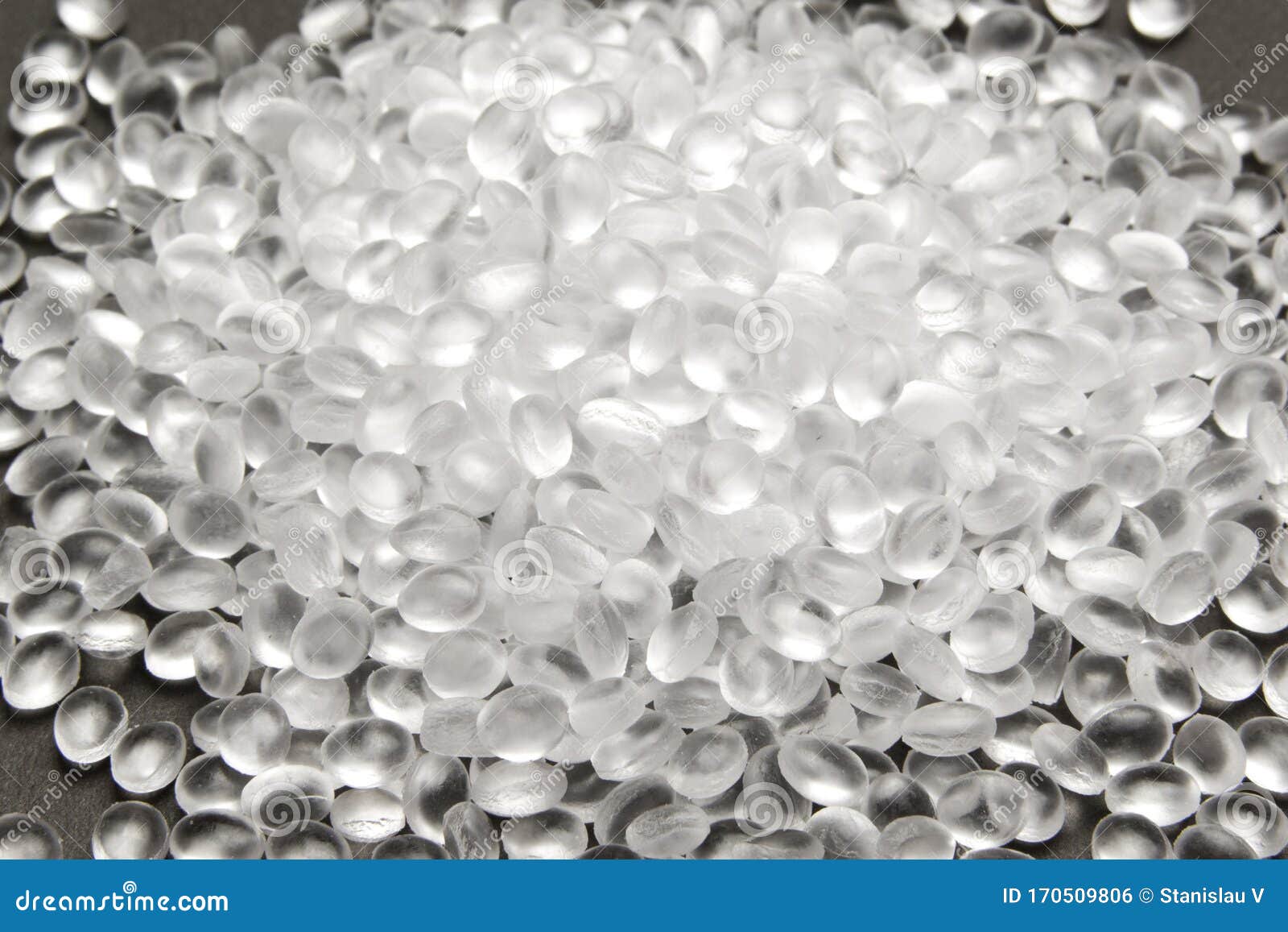 transparent polyethylene granules on dark .hdpe plastic pellets.  plastic raw material . idpe