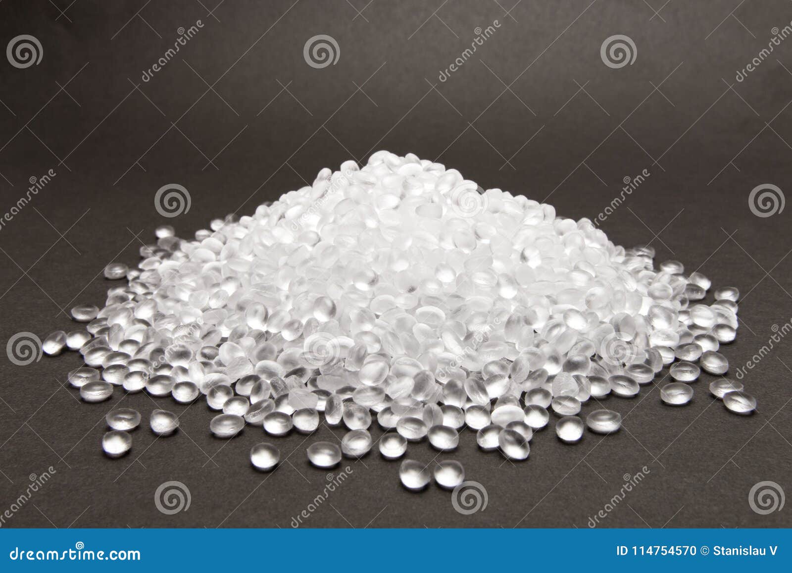 transparent polyethylene granules on dark .hdpe plastic pellets. plastic raw material . idpe.
