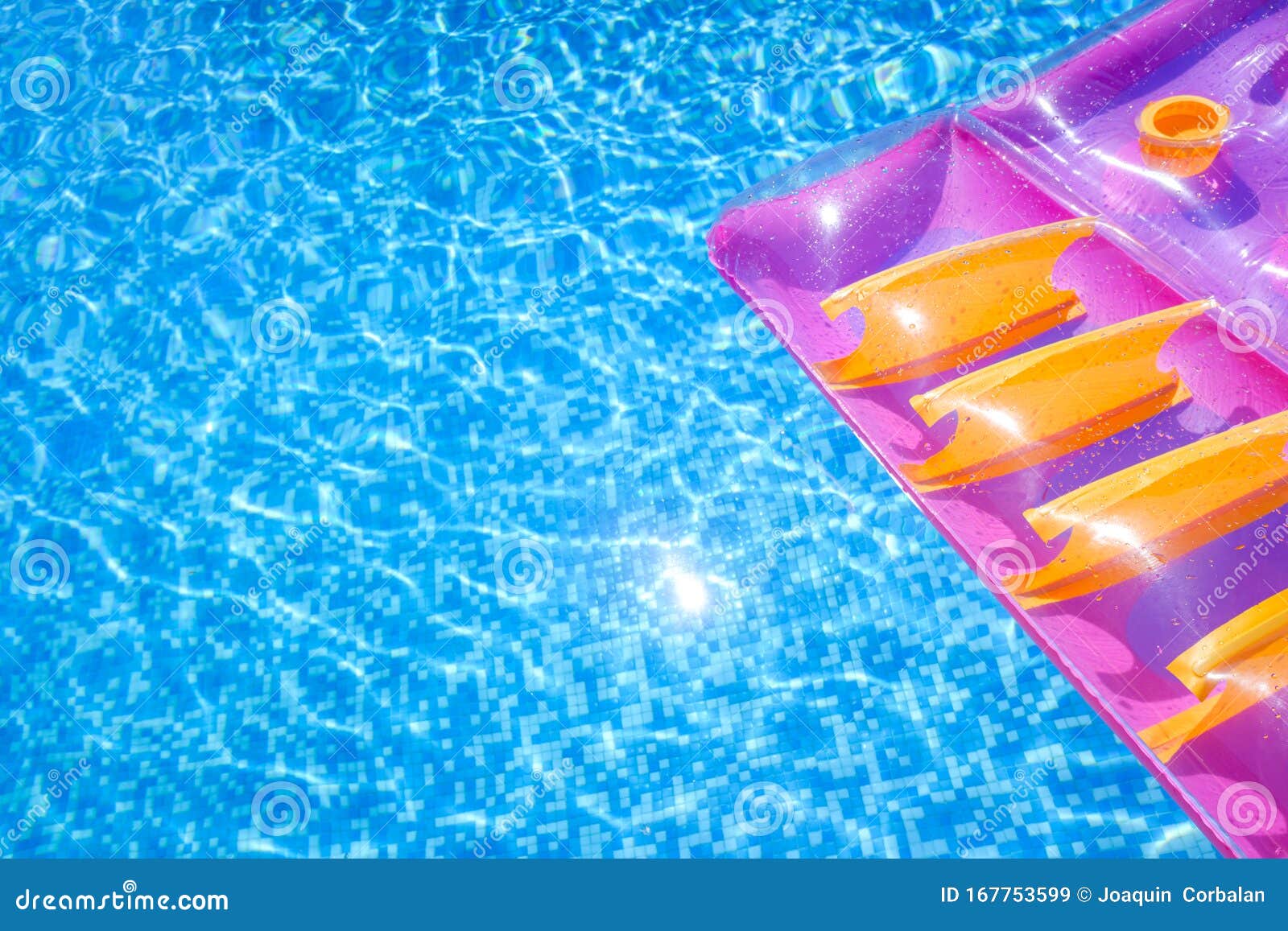 Transparent Water from a Pool, Background with Summer Colored Floats ...