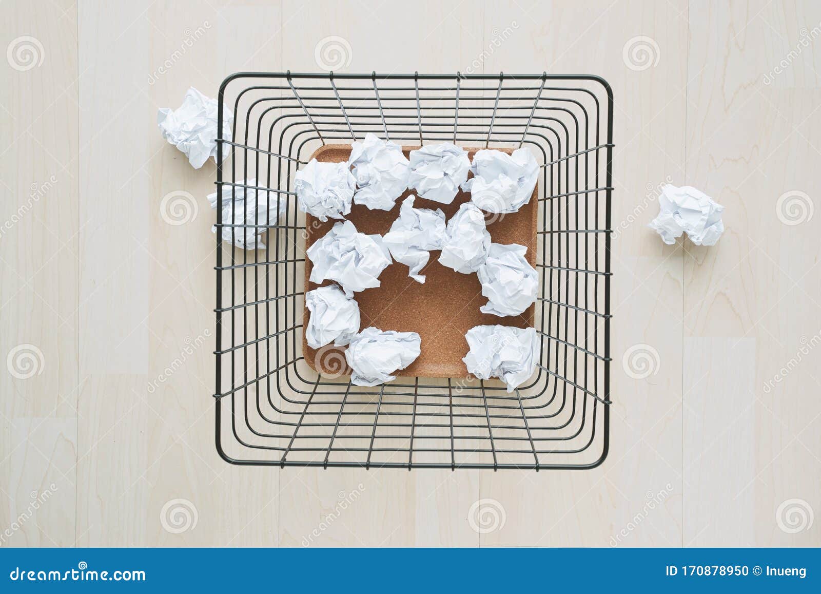 trash basket and paper crumples. overflowing waste paper in office garbage