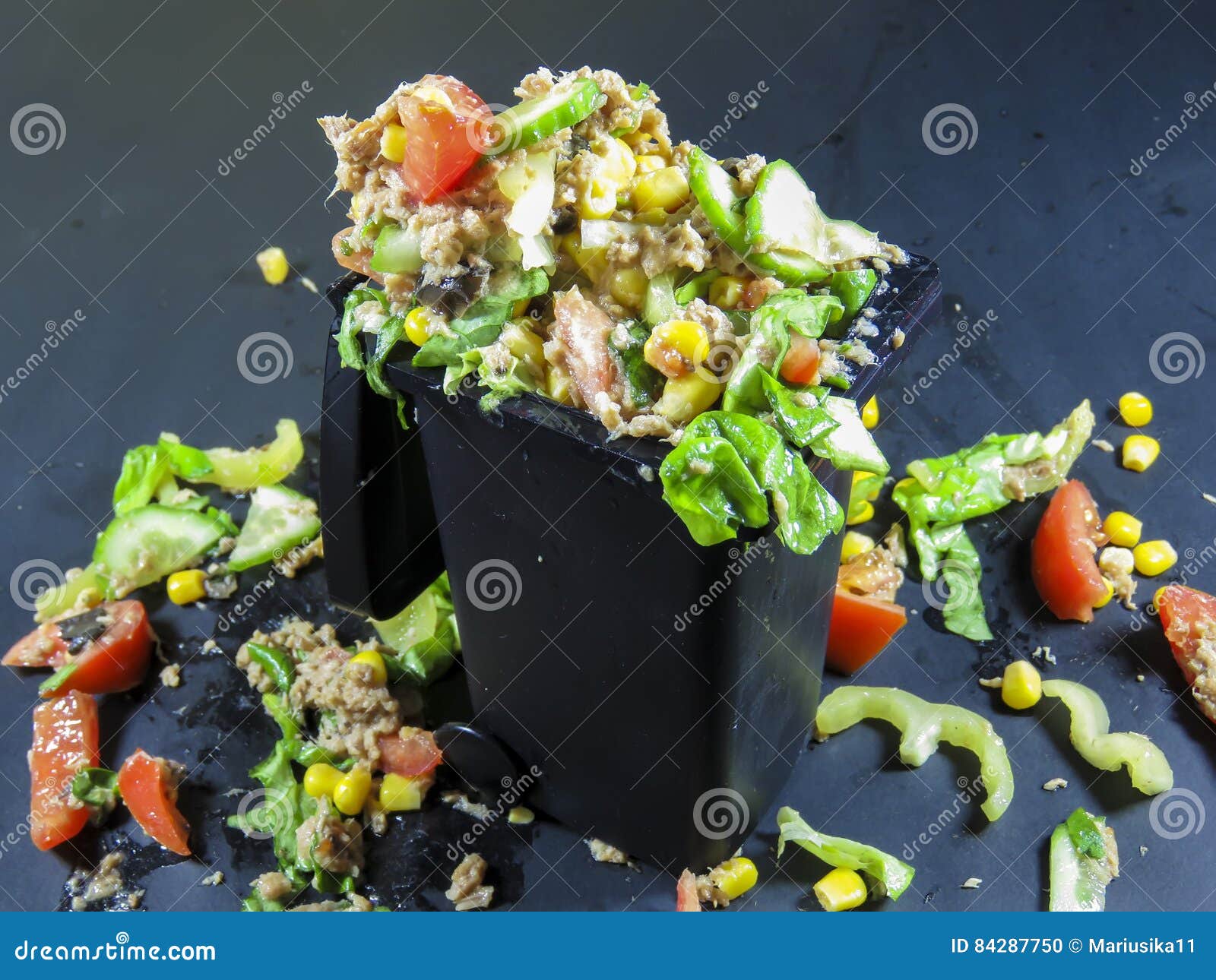 trash can filled with wasted food