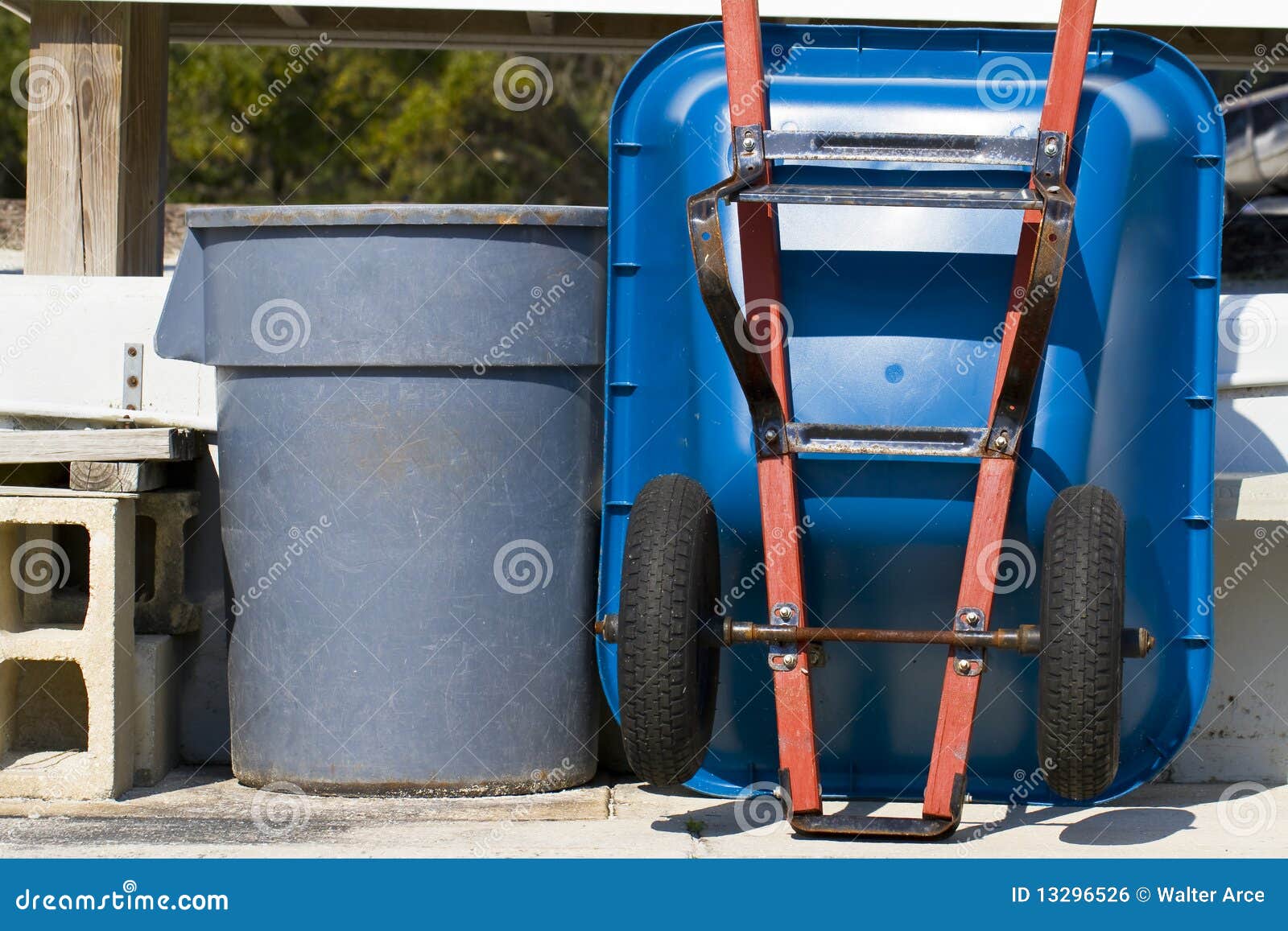 Trash Can and Wheel Barrel stock photo. Image of container - 13296526
