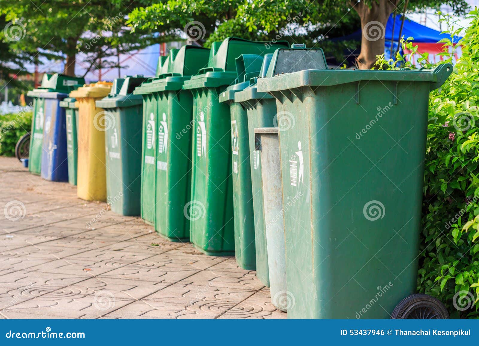 Trash cans in a row stock photo. Image of five, bottle 53437946