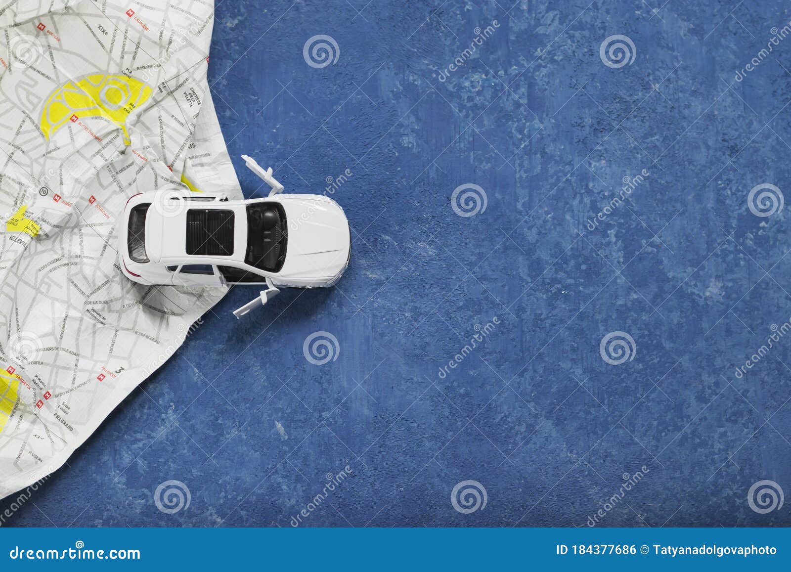 travel concept image. small car on a map of paris