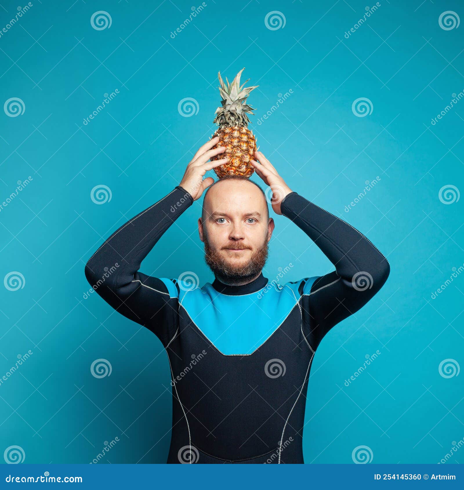 Travel Concept. Man Diver with Pineapple on His Head on Blue Background