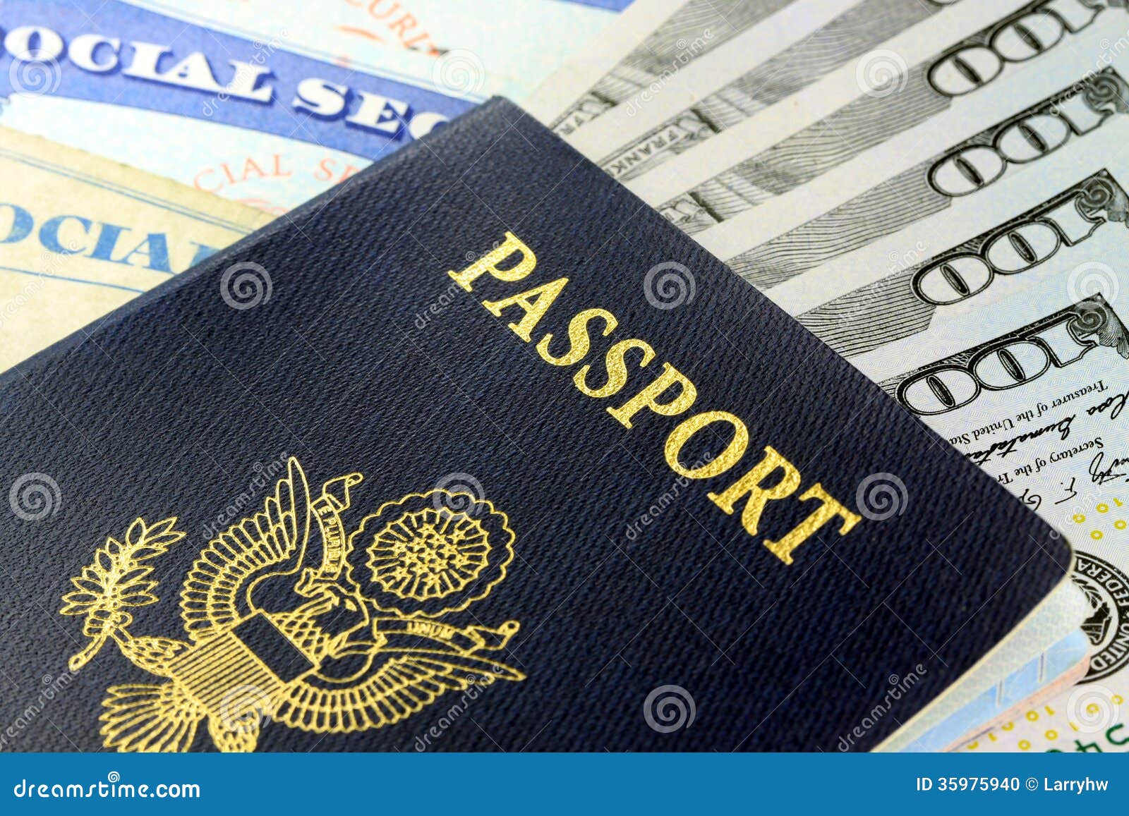 Travel Documents - USA Passport with American Currency Stock Photo