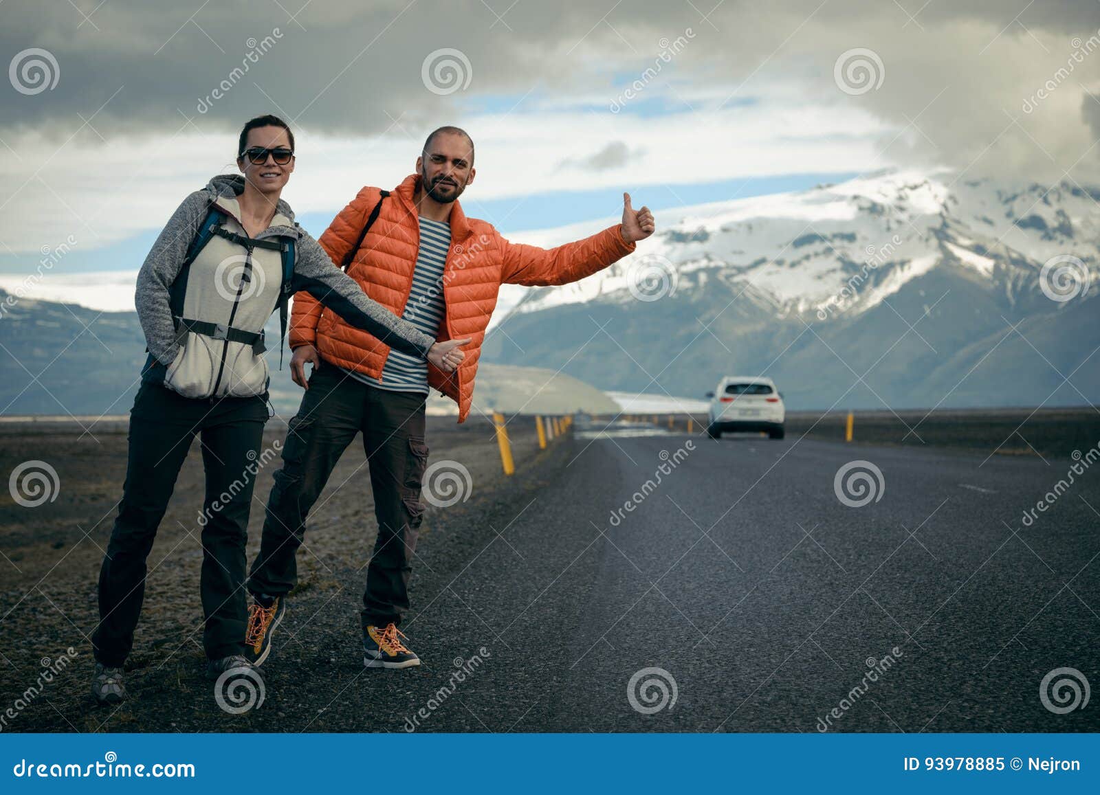 travel hitchhiker couple on a road