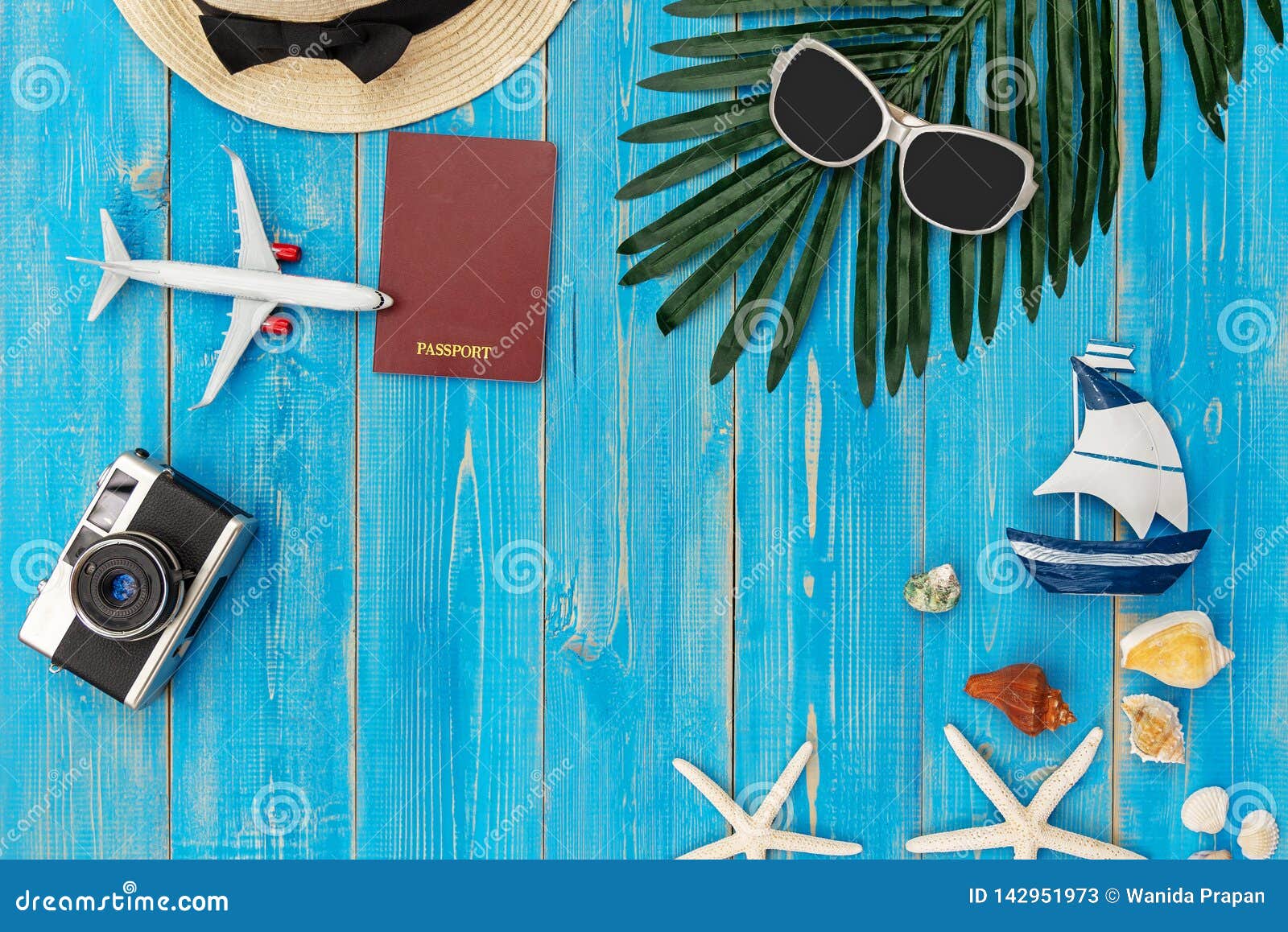 travel plan. traveler planning trips summer vacations on the beach with traveler`s accessories, retro camera, sunblock, sunglasse