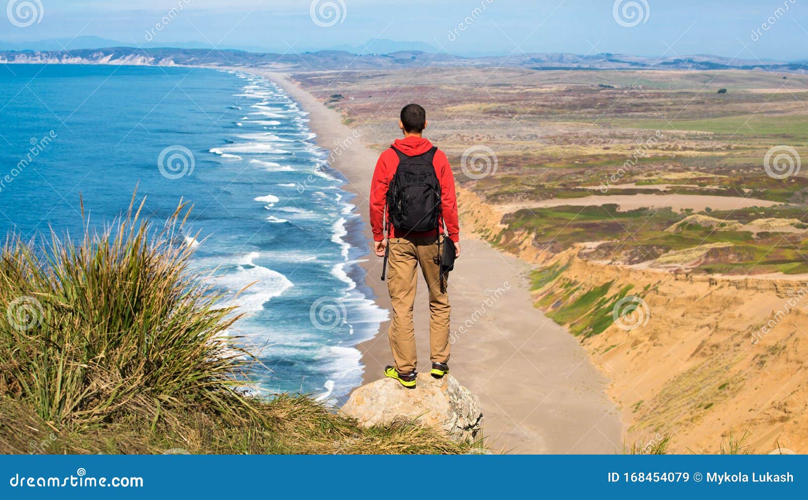 travel in point reyes national seashore, man hiker with backpack enjoying view, california, usa