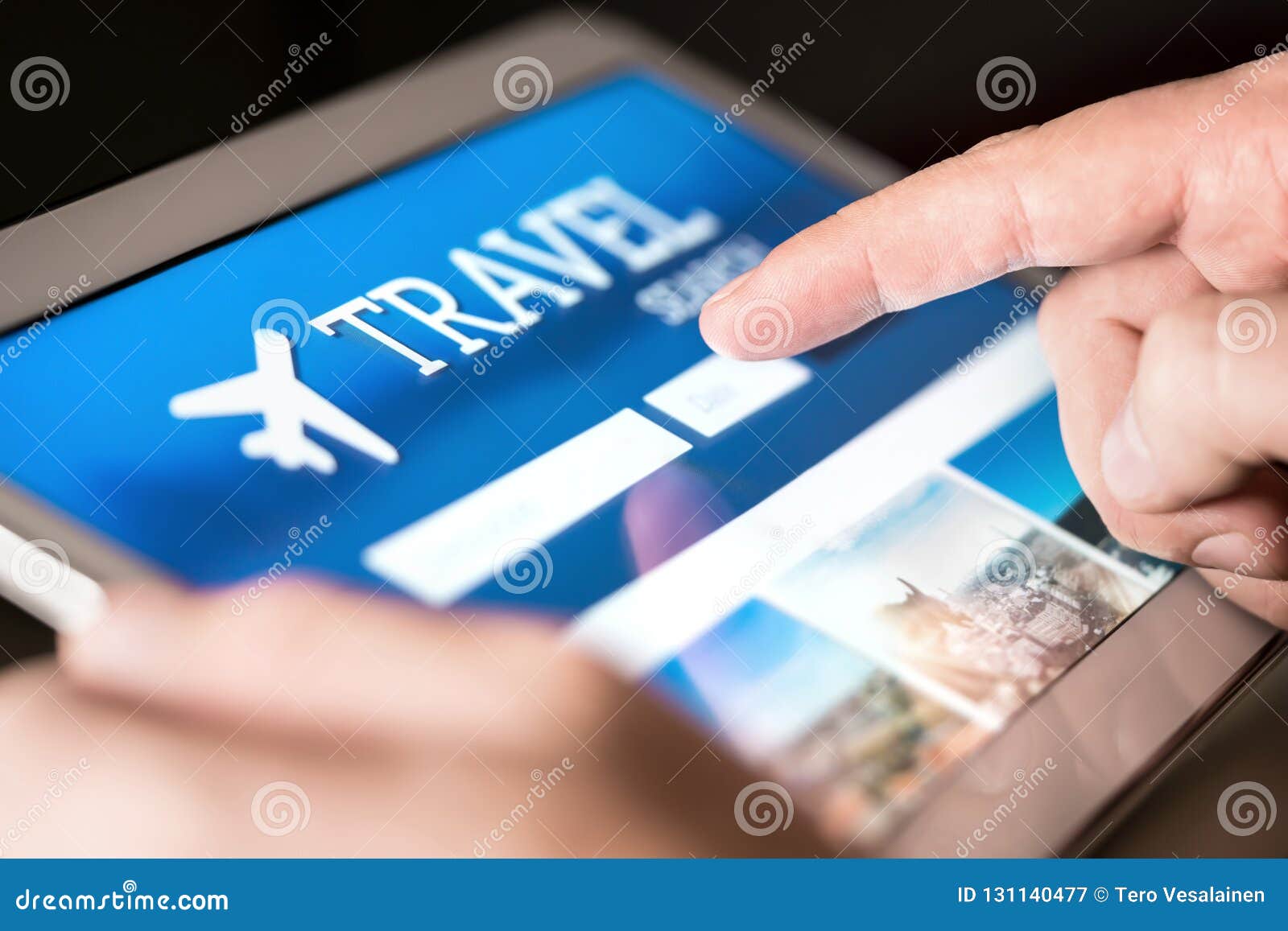 travel search engine and website for holidays. man using tablet to look for cheap flights and hotels.