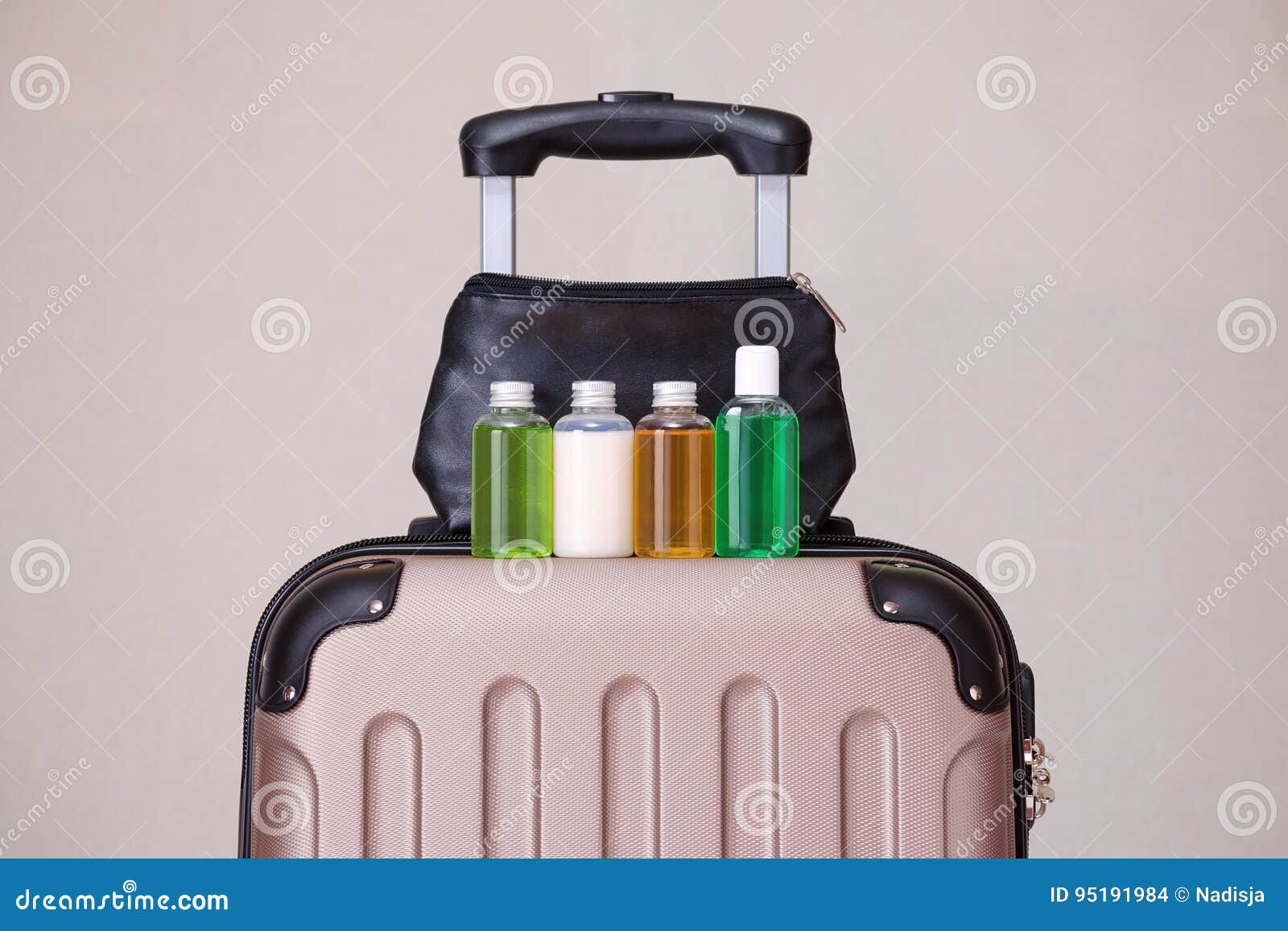 travel toiletries, small plastic bottles of hygiene products on the suitcase