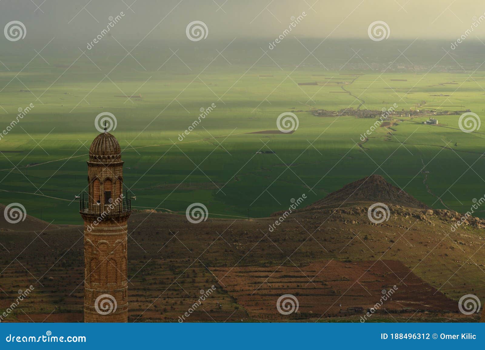 travel turkey. mardin. mardin grand mosque with mesopotamia plain. ancient city of mardin. sunset landscape