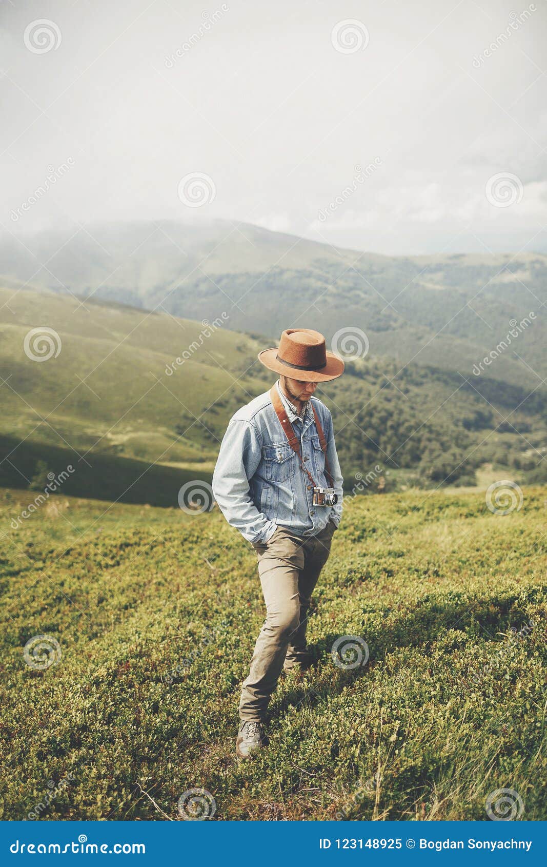 travel and wanderlust concept. stylish traveler man standing on