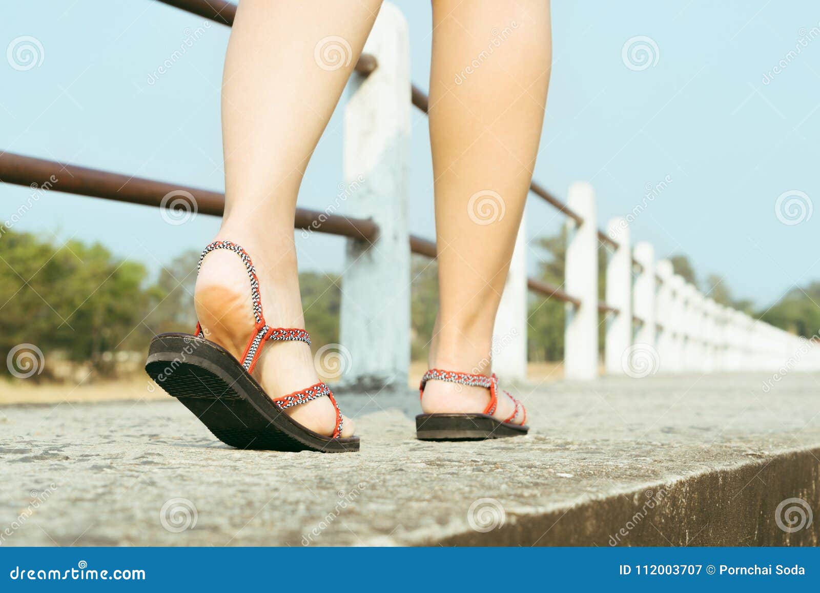 Traveler Young Women on Sneakers Shoe Walking on the Bridge on Sunny ...