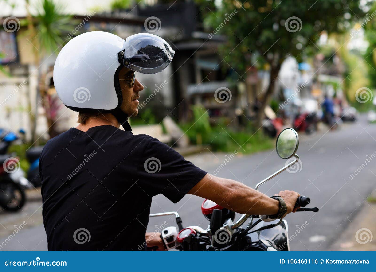 Traveller on a Motorbike on the Road. Man Driving Motorcycle on an
