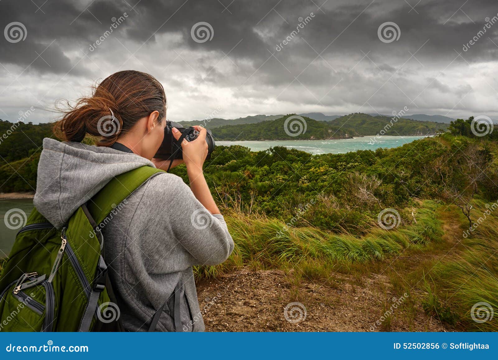 travelling woman photographer with backpack