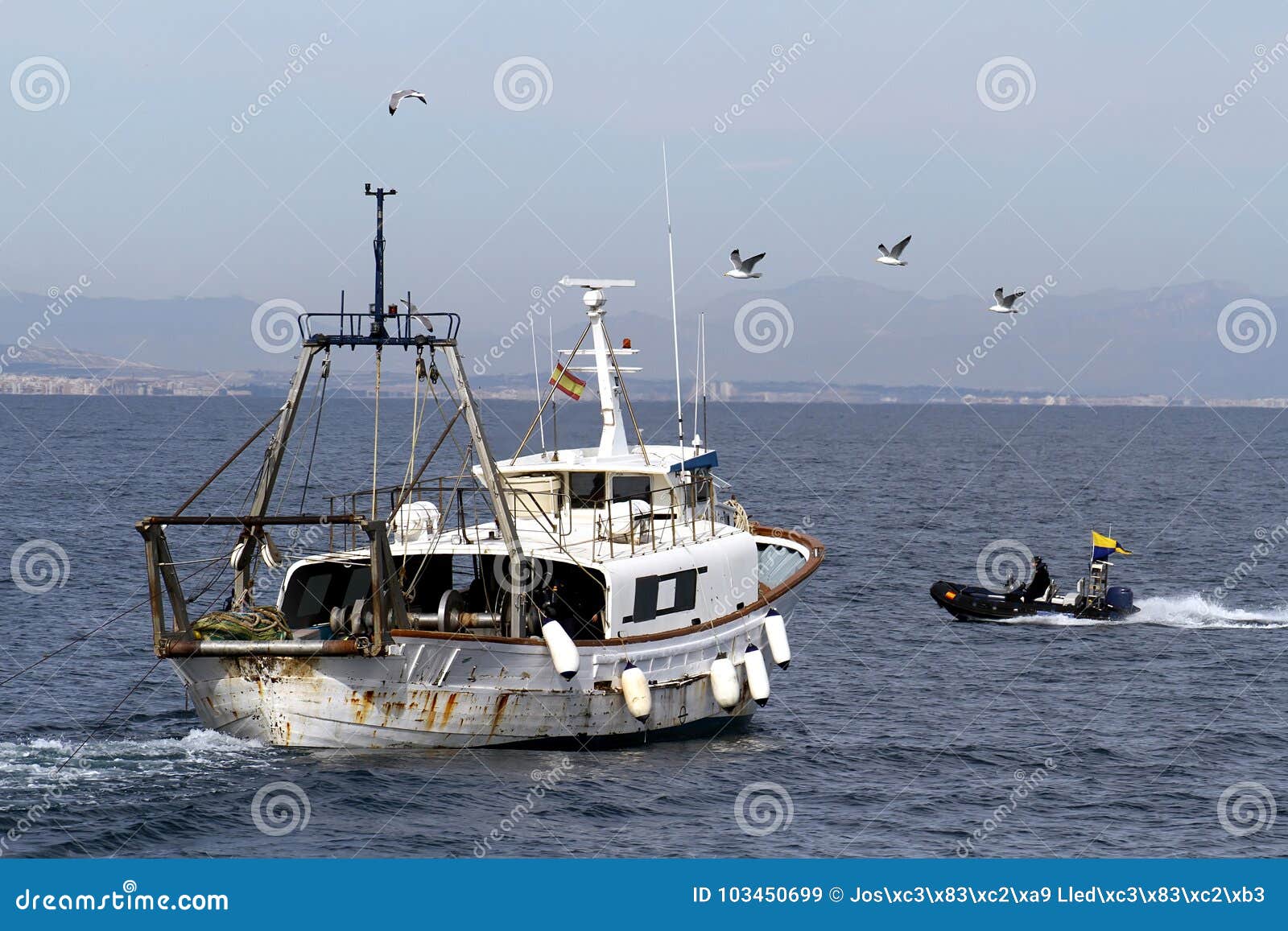 trawler fishing boat ready to use nets.