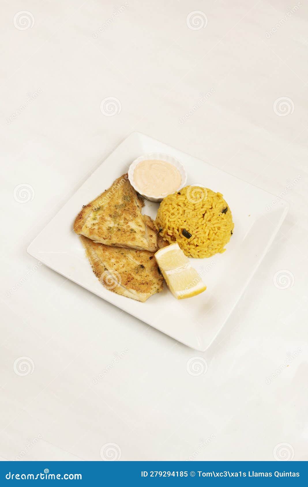 A Tray of Fried Flat Fish with a Bowl of Rice with Vegetables, Stock