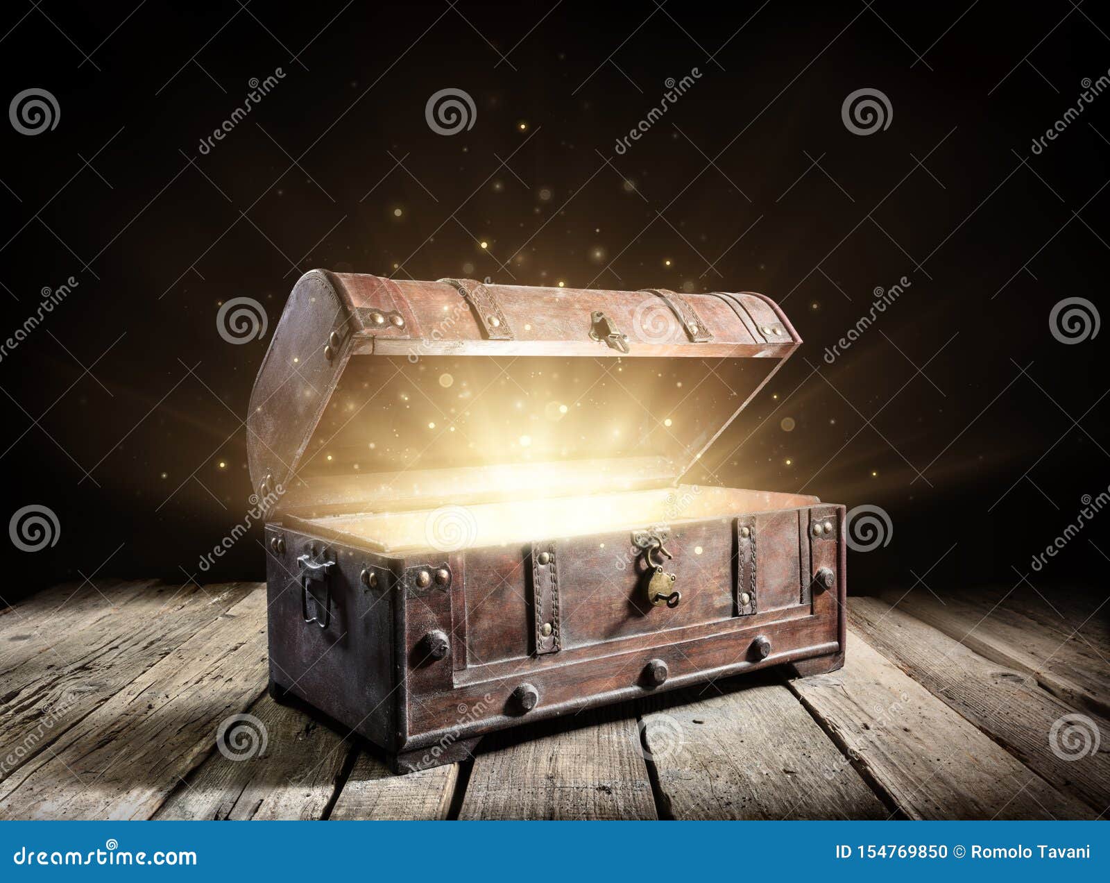 A golden treasure chest with one diamond in the chest have a lot of  treasure and a glowing bule magic stone