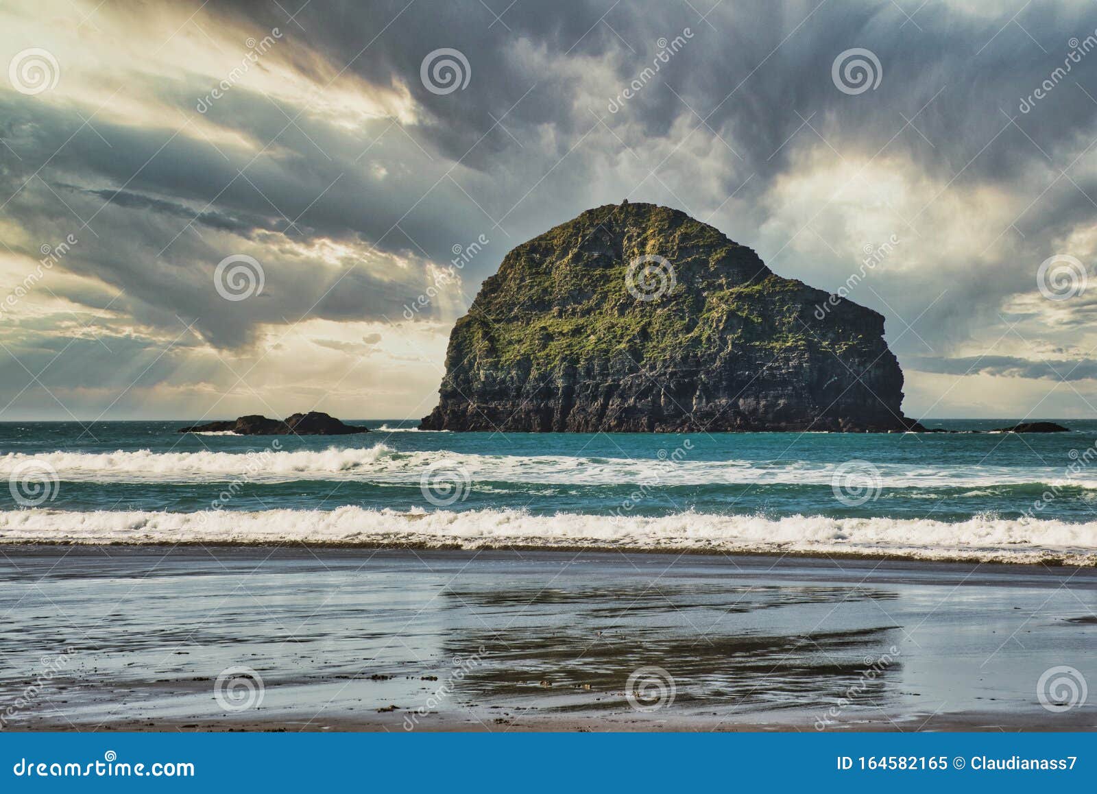Trebarwith Strand Beach with Gull Rock and Dramatic Sky Stock Image