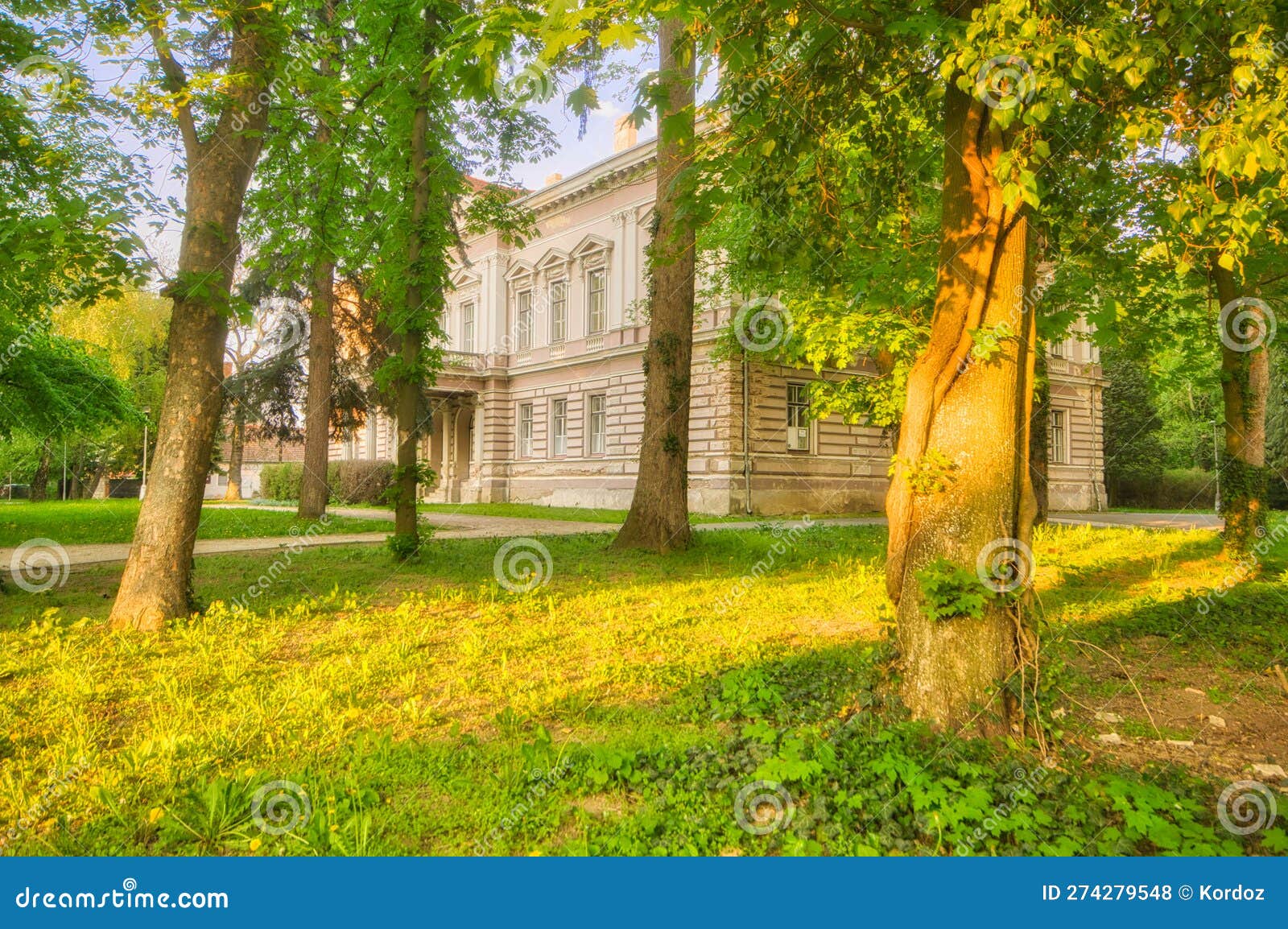 trees in the park in nova ves nad zitavou village near neo classicist manor house