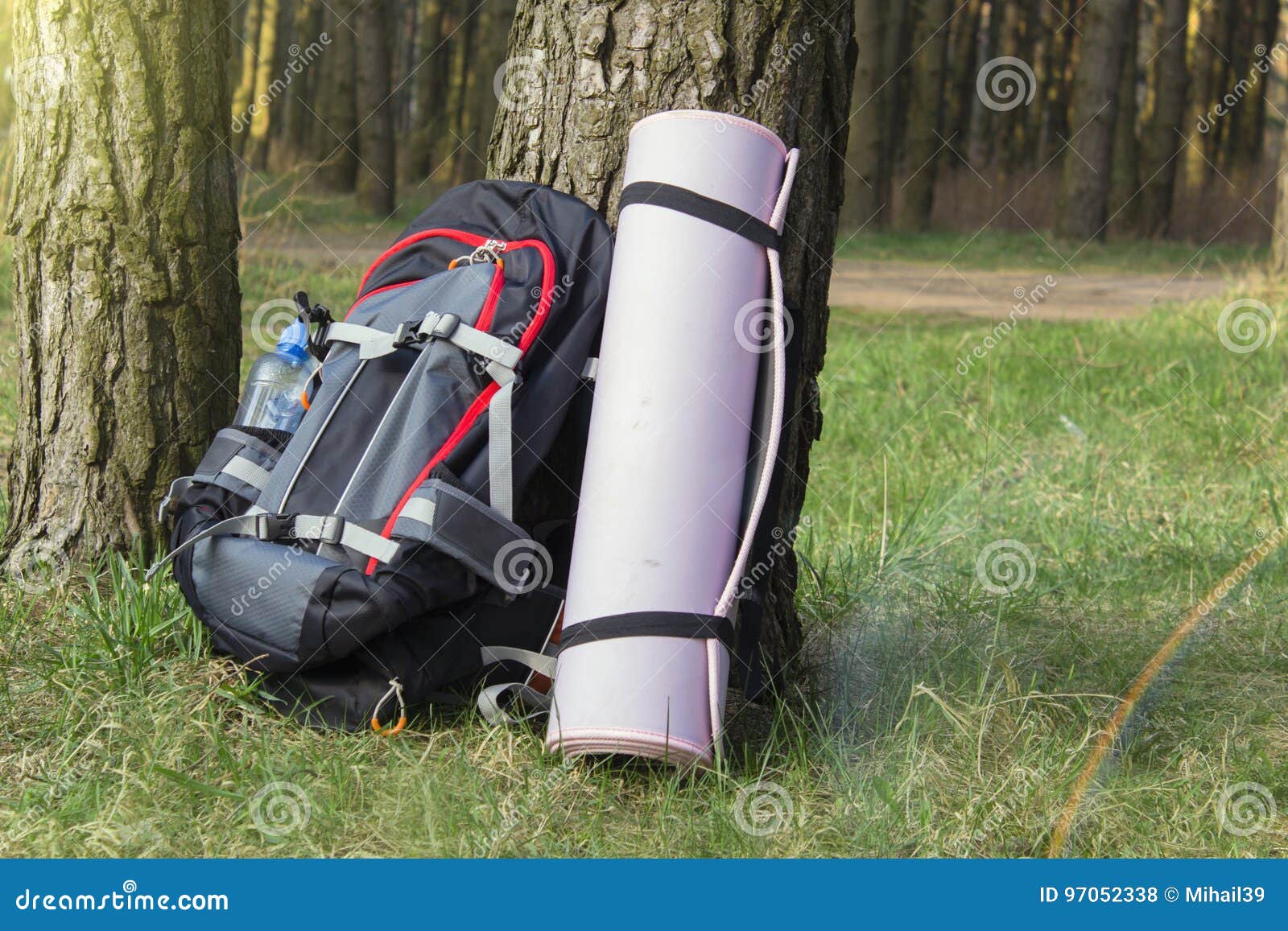 Trekking Heavy Backpack in Forest with Green Jars of Water. Stock Photo Image of outdoors