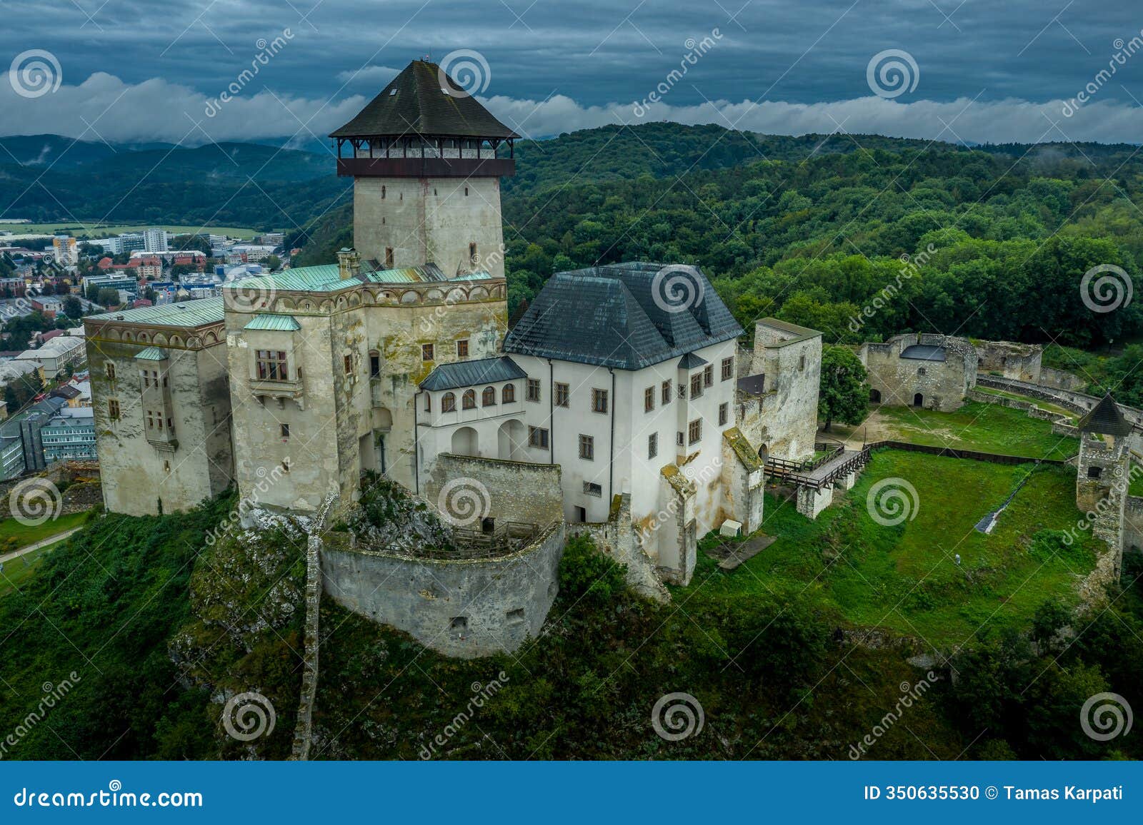 aerial panorama view of medieval newly restored trencin castle over the vah river in slovakia with dramatic sky