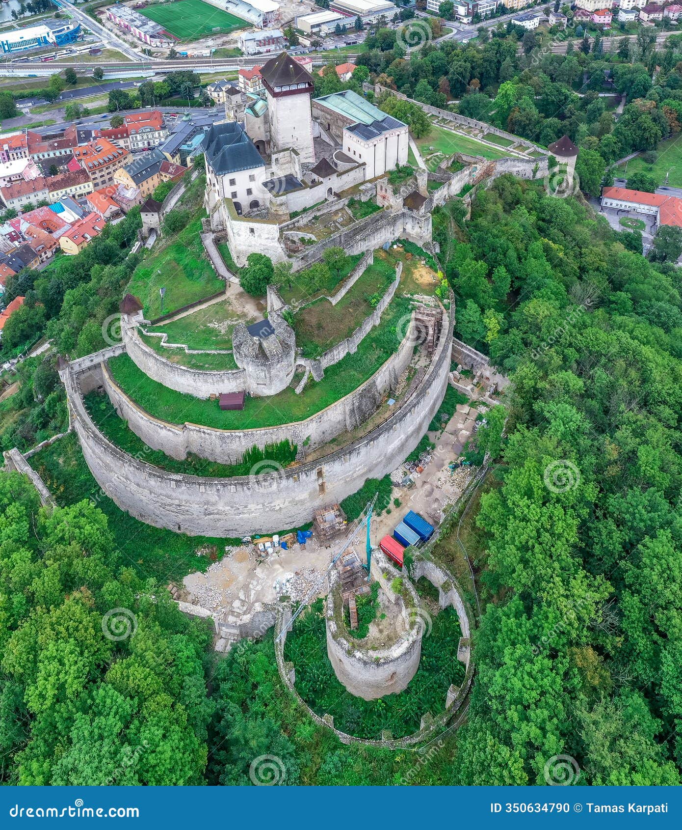 aerial view of medieval newly restored trencin castle with concentric walls over the vah river in slovakia