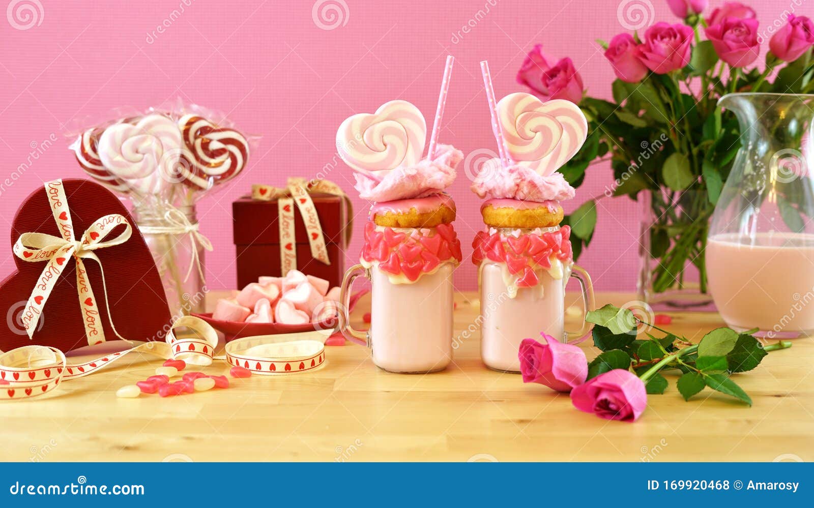 valentine`s day freak shakes with heart d lollipops and donuts.
