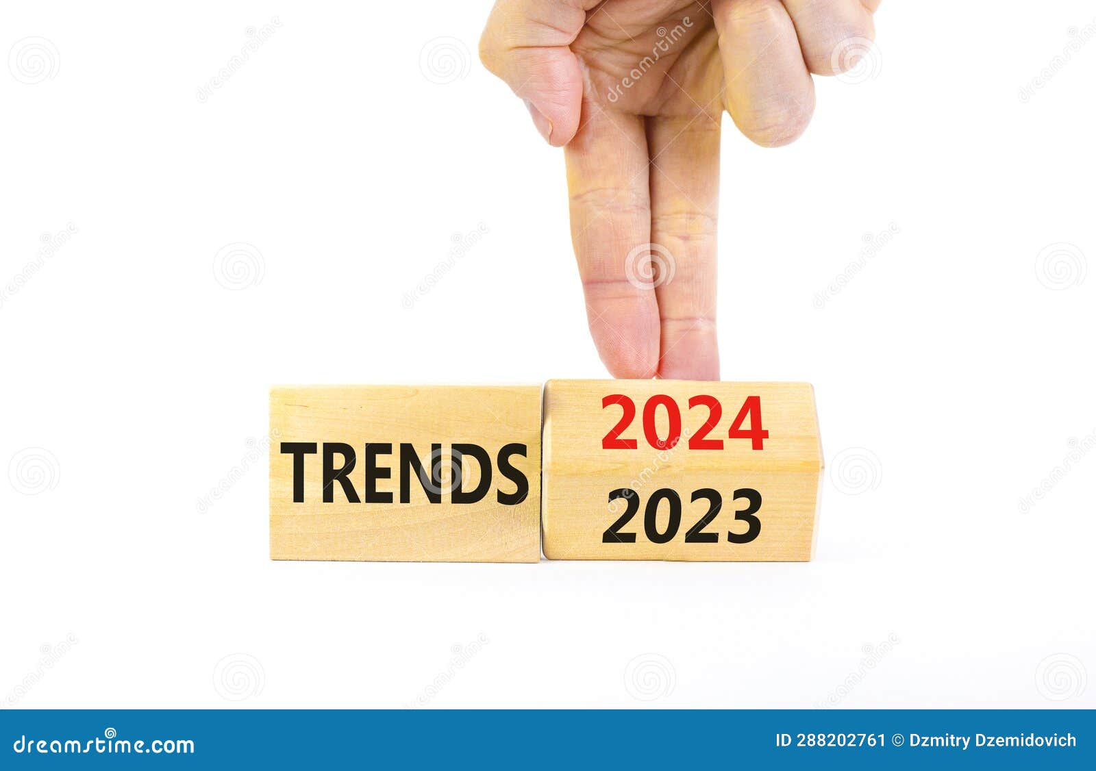 2024 Trends New Year Symbol. Businessman Turns a Wooden Cube and