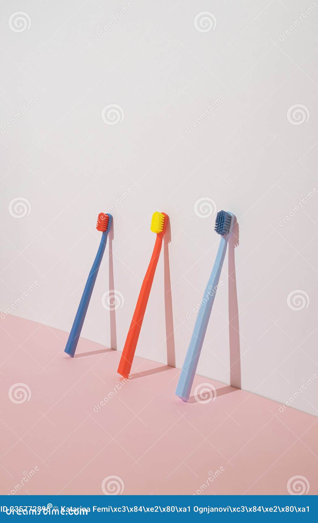 Trendy Minimal Composition with Three Colorful Toothbrushes on Pastel ...