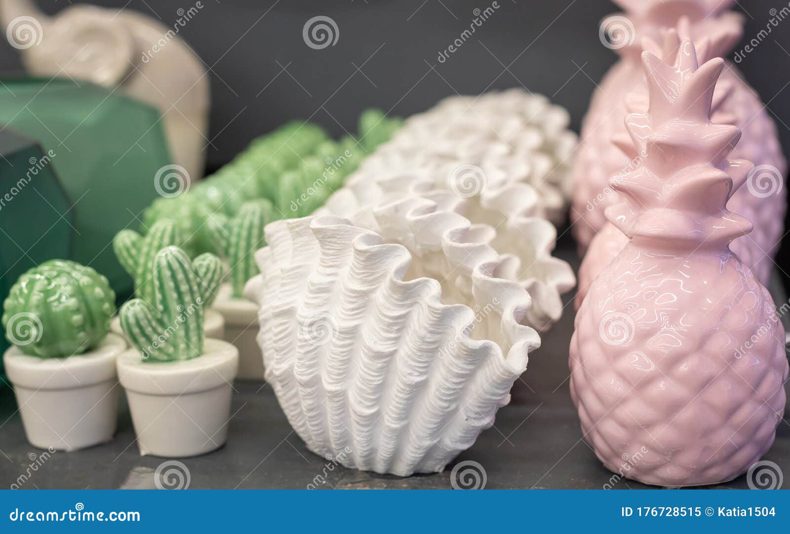 trendy pastel color exotic pineapple, shell and cactus d ceramic vases, arte deco style home decor, selective focus