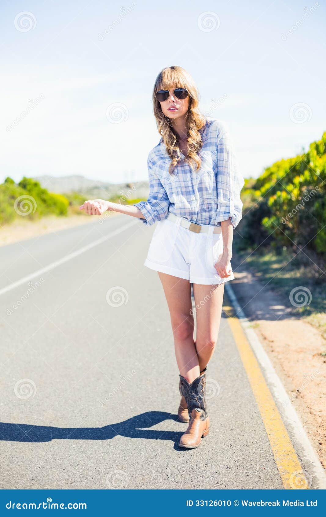 Trendy Model Hitchhicking at the Roadside Stock Photo - Image of cowboy ...