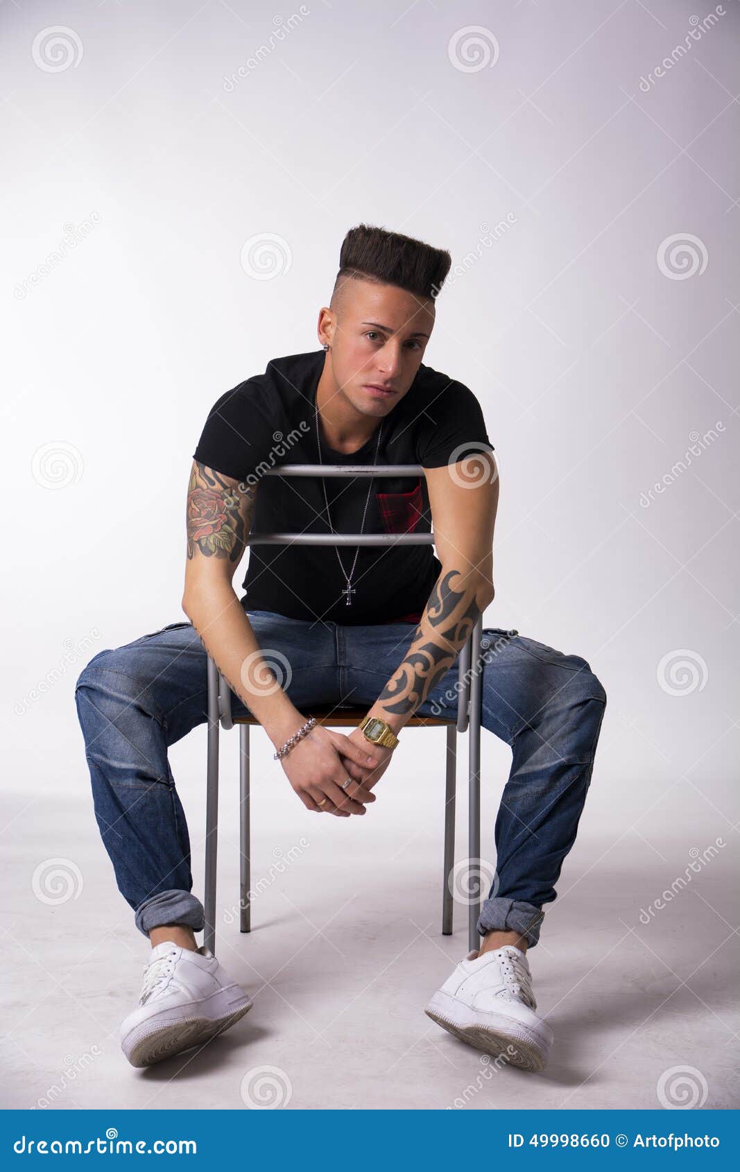 Trendy Tattooed Young Man Sitting On Chair Stock Photo - Image of look