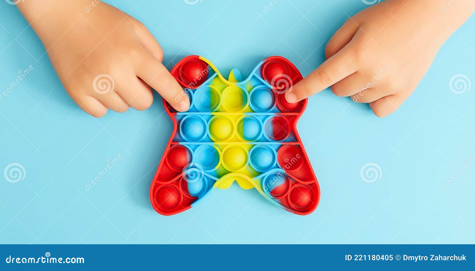 Childs Hands Playing With Colorful Poppit Game Pop It Fidget Toy