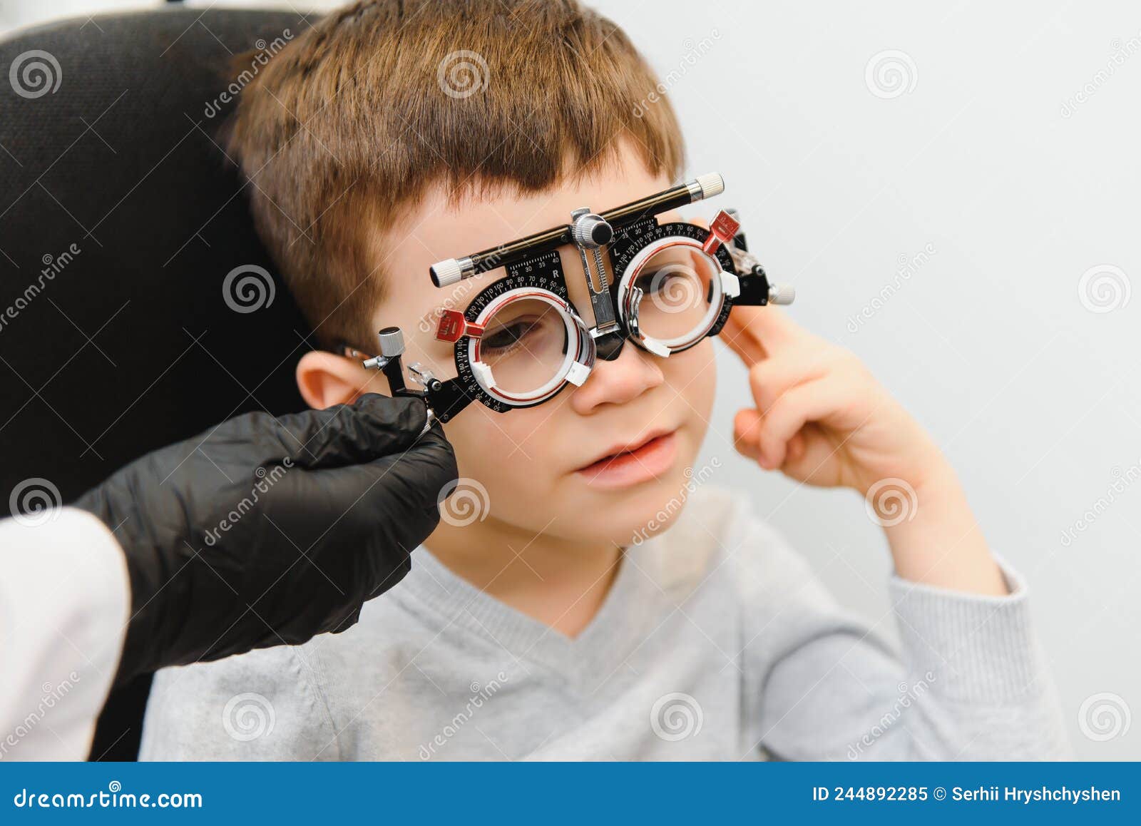 trial frame. glasses for a little boy. hypermetropia. ametropia correction with glasses