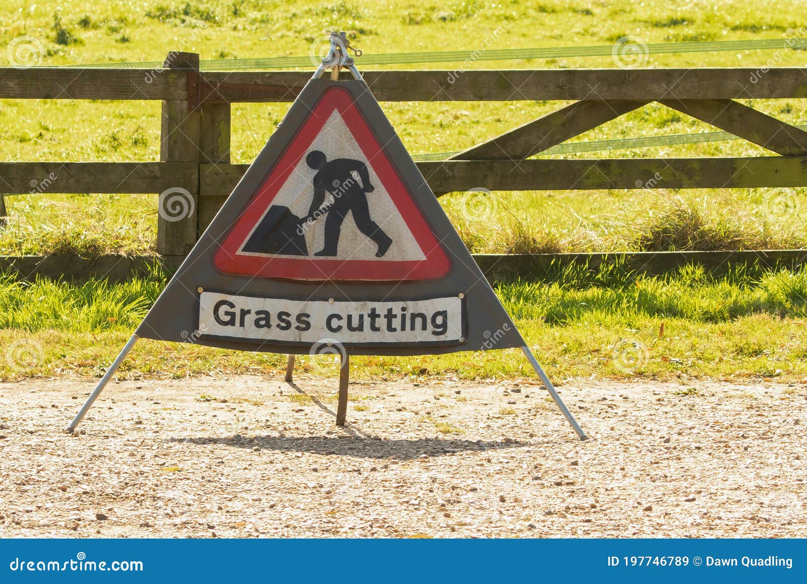 Triangle Warning Sign with Warning Saying Grass Cutting with Copy Space