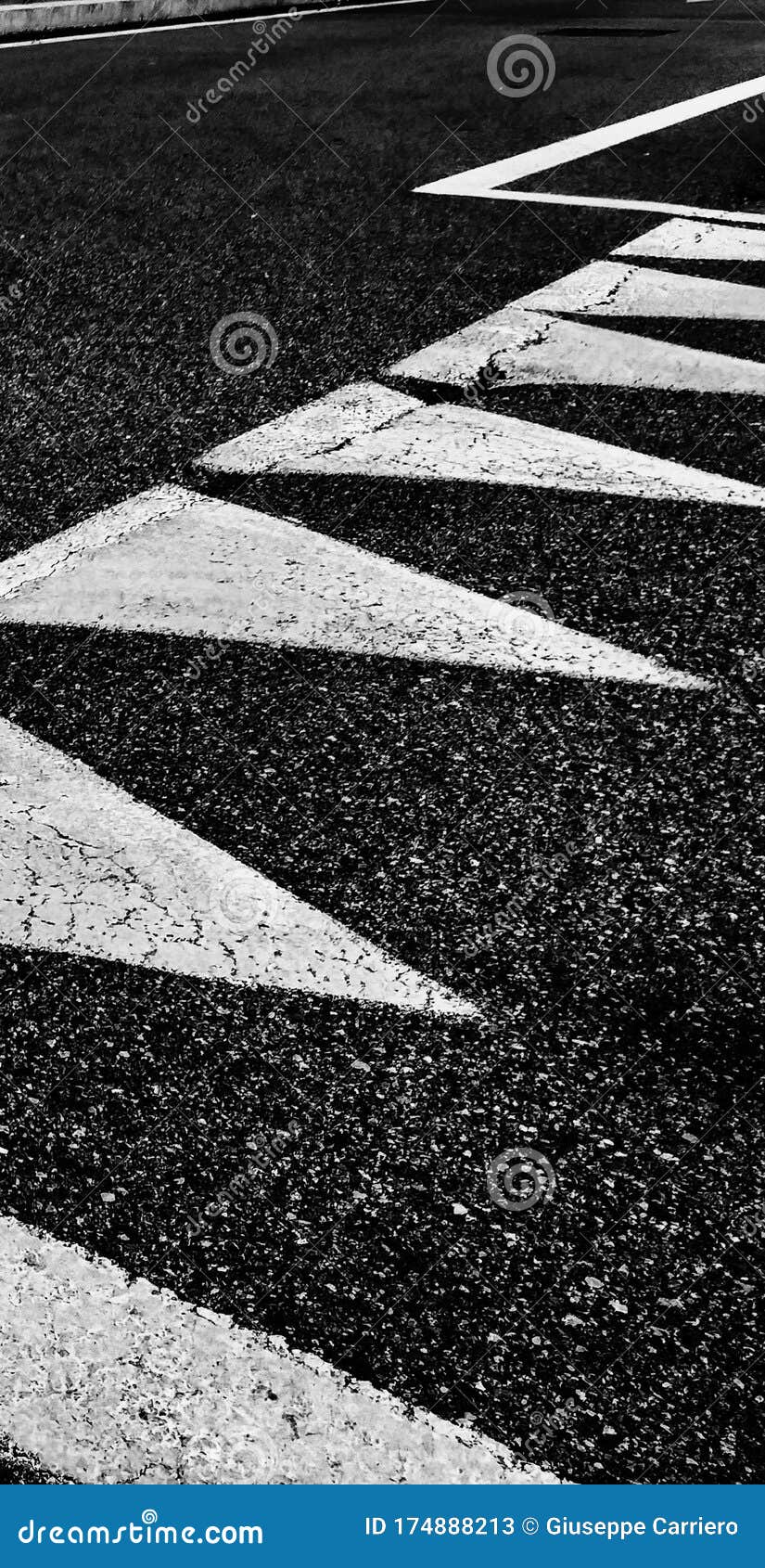 triangles drawn in a row on the road to mark a precedence and consequently a stop.